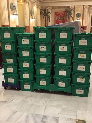 Commercial storage bins stacked inside empty retail store space