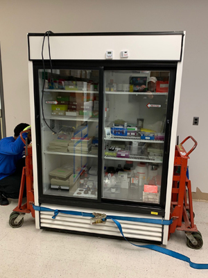 Large laboratory incubator being professionally moved