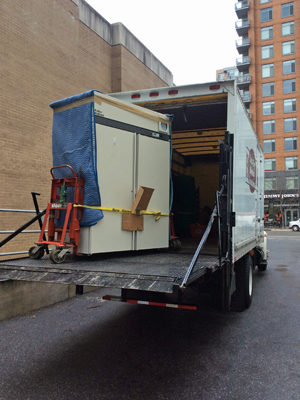 Commercial moving truck loading medical office equipment